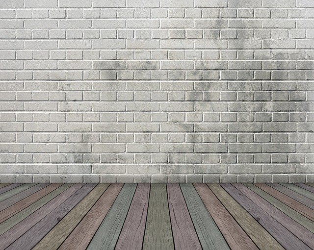 White brick wall and wood floor